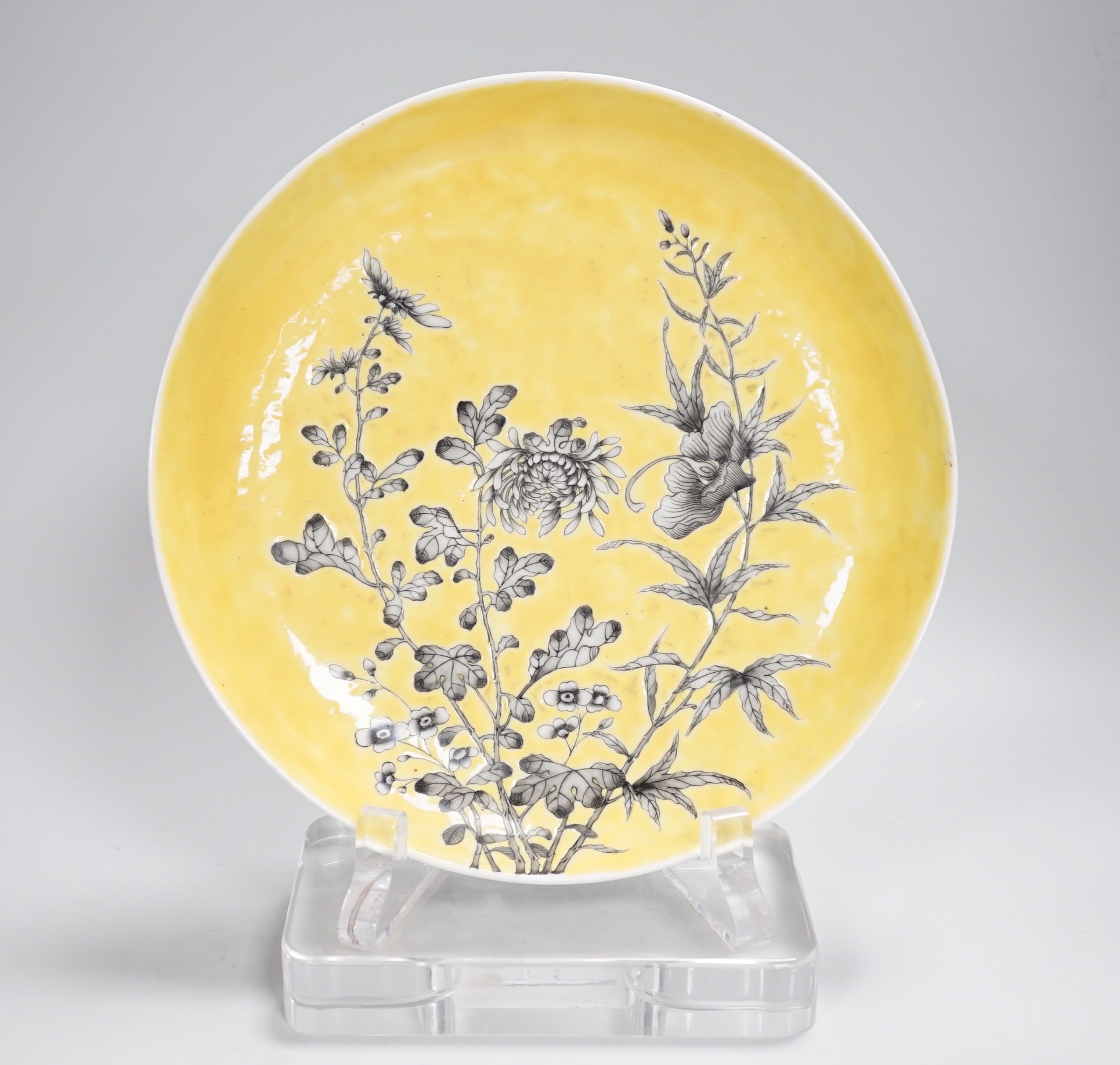 A Chinese grisaille enamel yellow ground dish, Guangxu mark and possibly of the period (1875-1908), 24cm in diameter